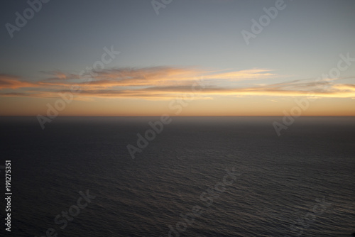 Sunset over the ocean © Paul