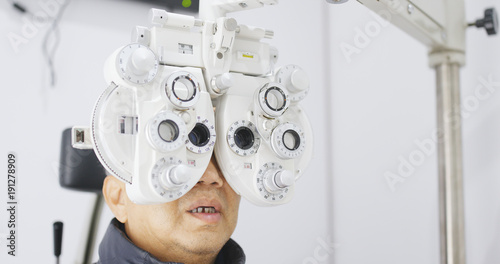 Old man undergo eye test