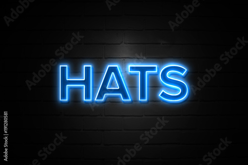Hats neon Sign on brickwall