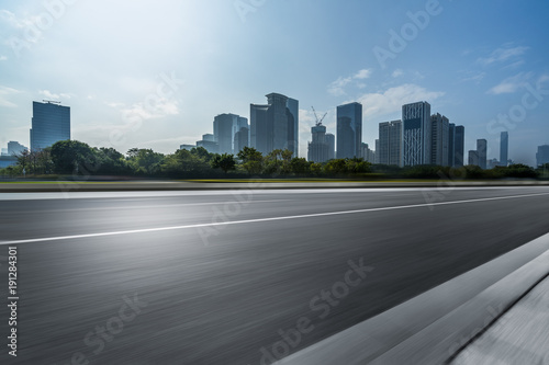 Fototapeta Naklejka Na Ścianę i Meble -  empty asphalt road with city skyline background in china.