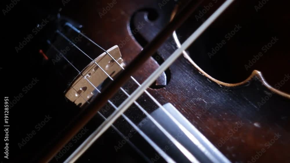 Playing the violin in the shadows Playing the violin in the shadows