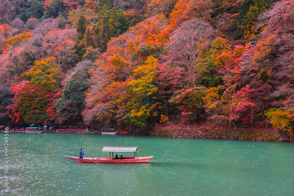 Naklejka premium Boatman punting the boat at Katsura River.