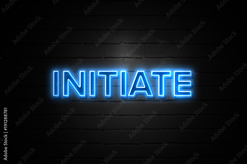 Initiate neon Sign on brickwall