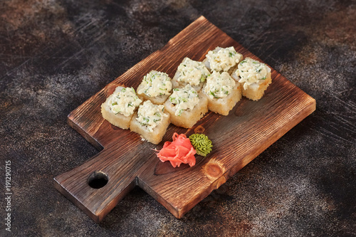 Japanese food sushi maki rolls on wooden board