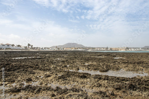 town of Corralejo from rocky point at low tide