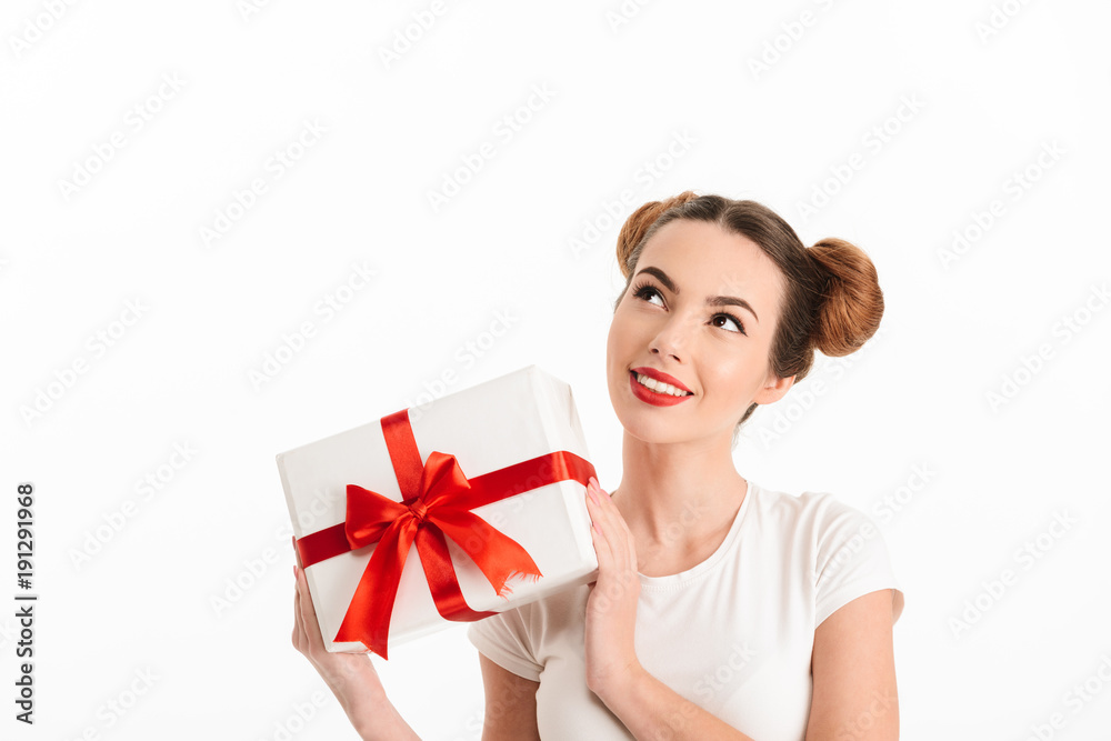 Portrait of a lovely casual girl holding gift box Portrait of a lovely casual girl holding gift box