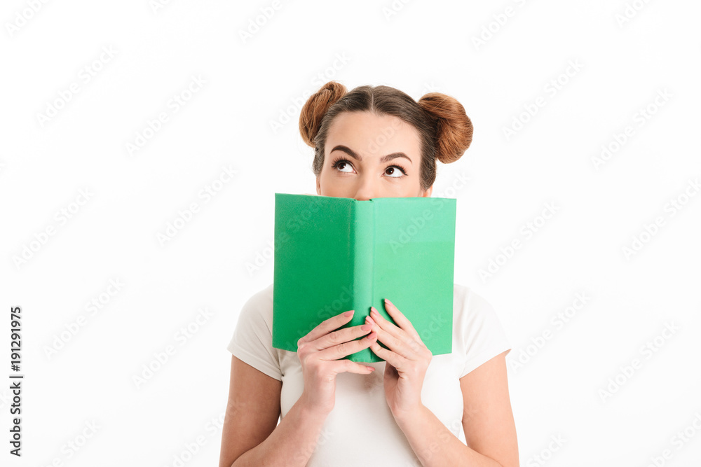 Portrait of a pretty casual girl holding open book Portrait of a pretty casual girl holding open book