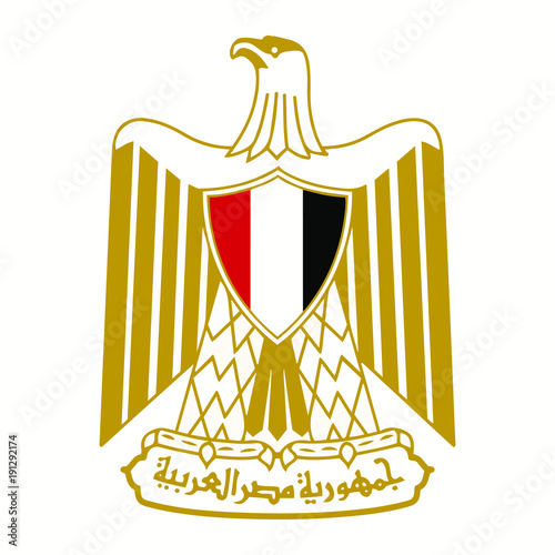 The Coat Of Arms Of Egypt. Shield  on the breast of the Golden eagle, looking right, holding in the paws a ribbon with an inscription in Arabic of the Arab Republic of Egypt.