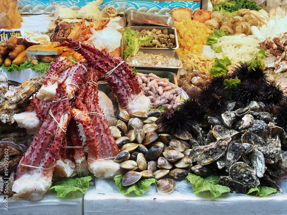 Fresh octopus and other seafood displayed in night market  