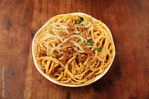 Chinese fried noodle on the wooden table