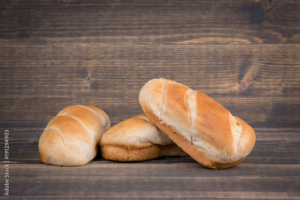 fresh light bread on a wood, food background