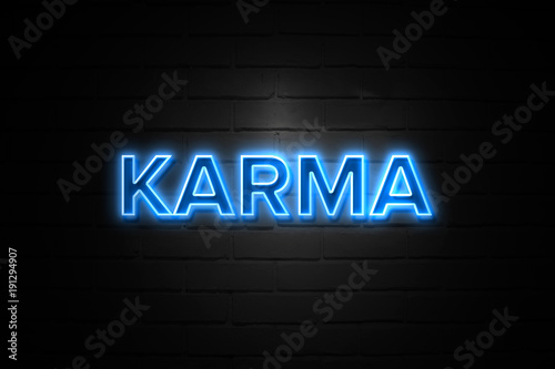 Bild auf Leinwand Karma neon Sign on brickwall