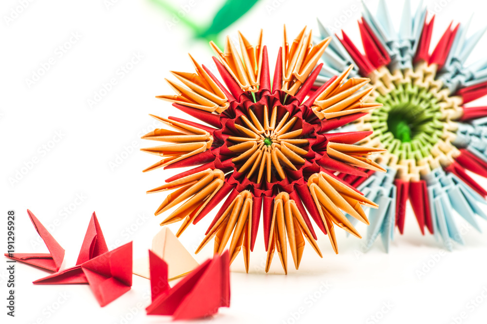 two modular origami flowers with module blocks isolated on white background