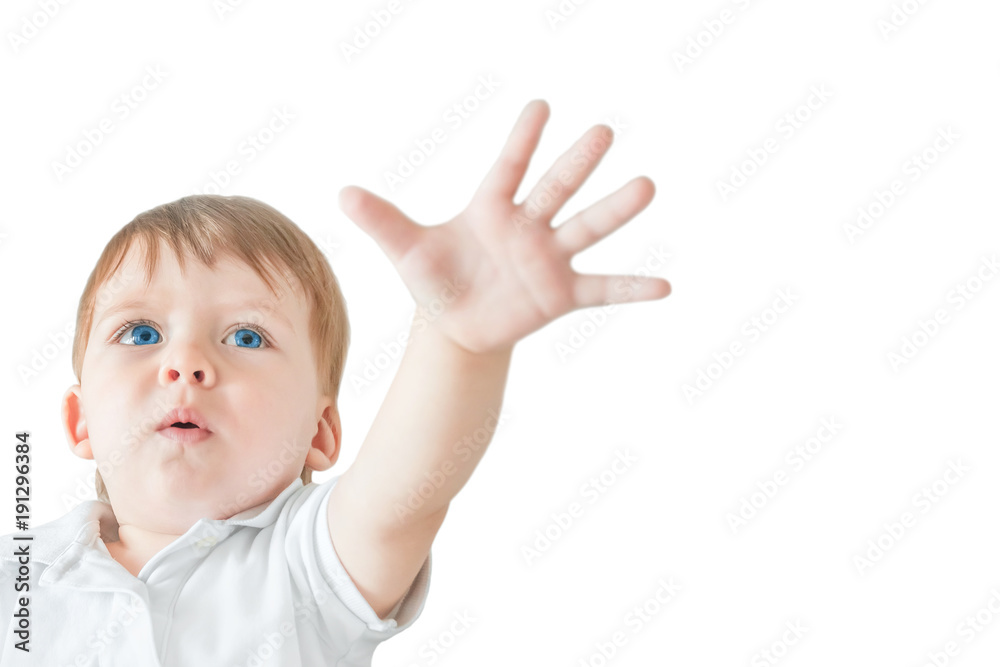 Portrait of a blonde baby boy with blue eyes showing a hand stop gesture. Isolated Portrait of a blonde baby boy with blue eyes showing a hand stop gesture. Isolated