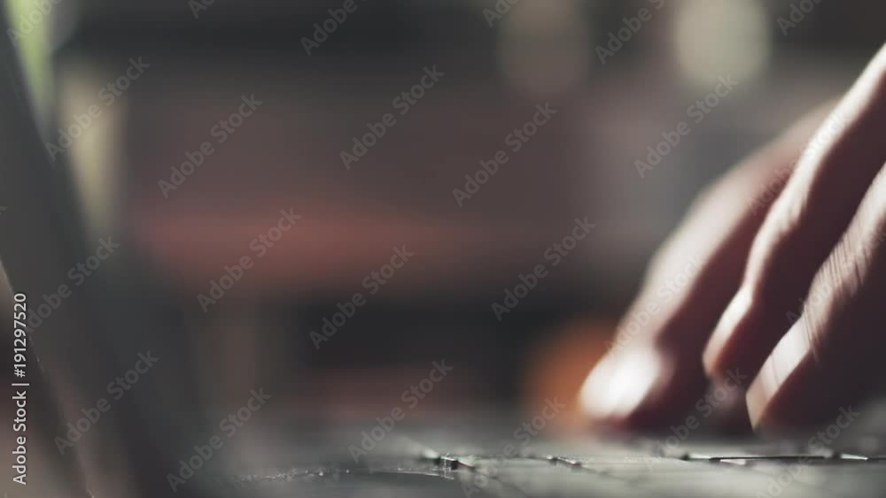 young female hands using notebook on a table in cafe young female hands using notebook on a table in cafe