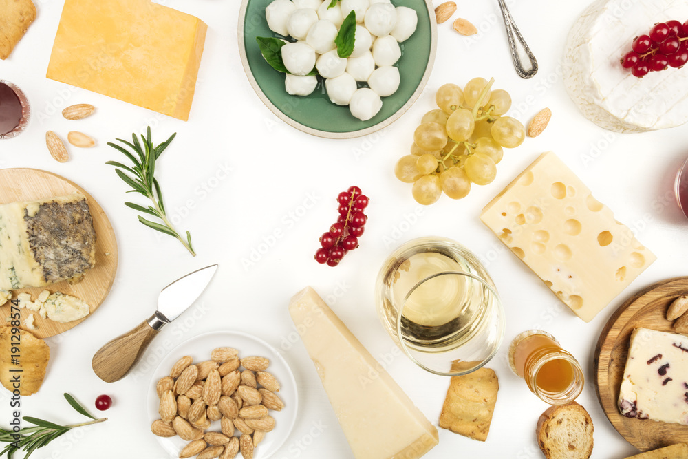 Selection of cheeses on white with copy space Selection of cheeses on white with copy space