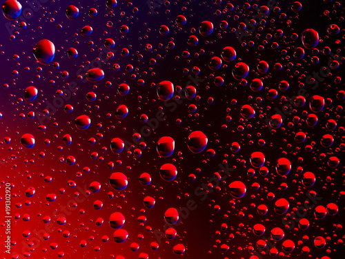 Water droplets on a dark red background and blue highlights 