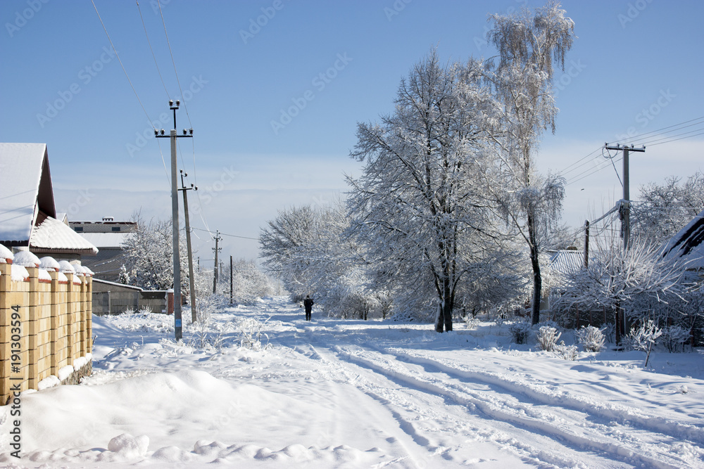 Winter street in the snow, a sunny winter day, at home Winter street in the snow, a sunny winter day, at home