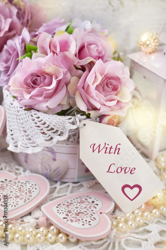 romantic love decoration in shabby chic style for wedding or valentines with text on paper label