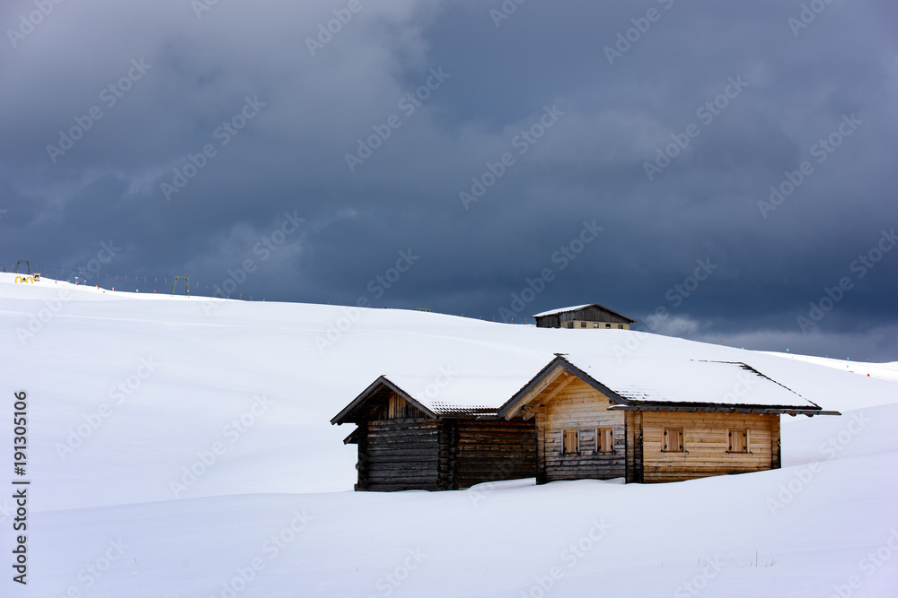 Hut in the snow. Magic atmosphere in the Dolomites