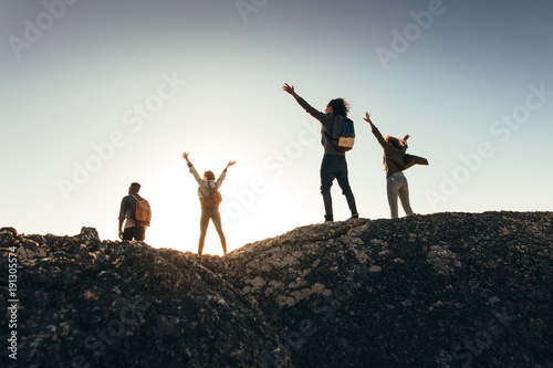 Friends enjoying the view from mountain top