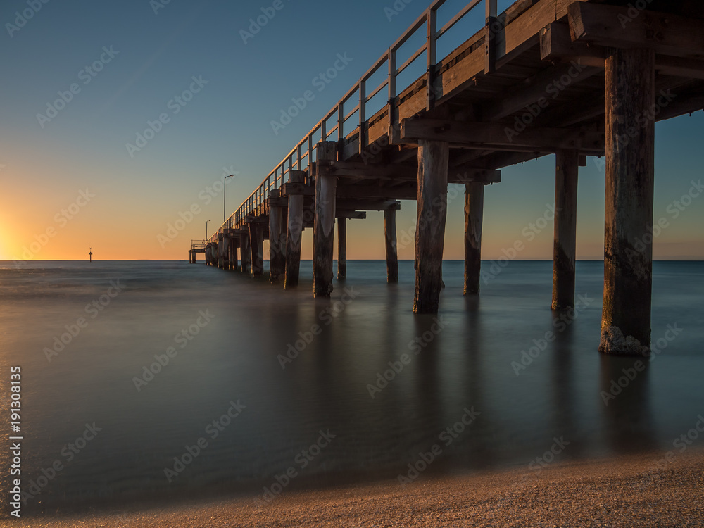 Long exposure of the sunset under Seaford Pier, Australia	