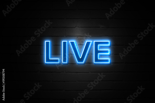 Live neon Sign on brickwall photo