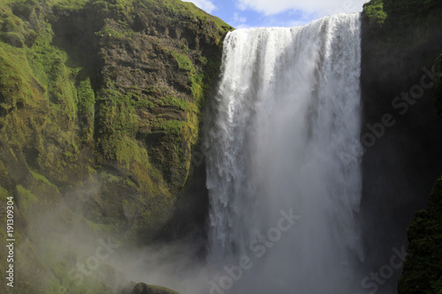 Fototapeta Naklejka Na Ścianę i Meble -  Water is blown into the air at an impressive waterfall in Iceland