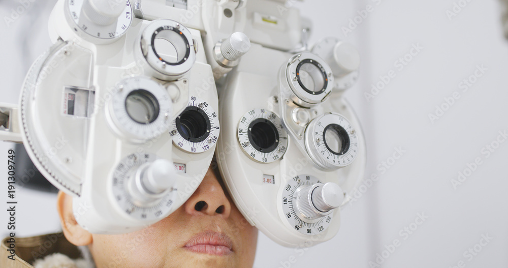 Senior woman undergo eye test Senior woman undergo eye test