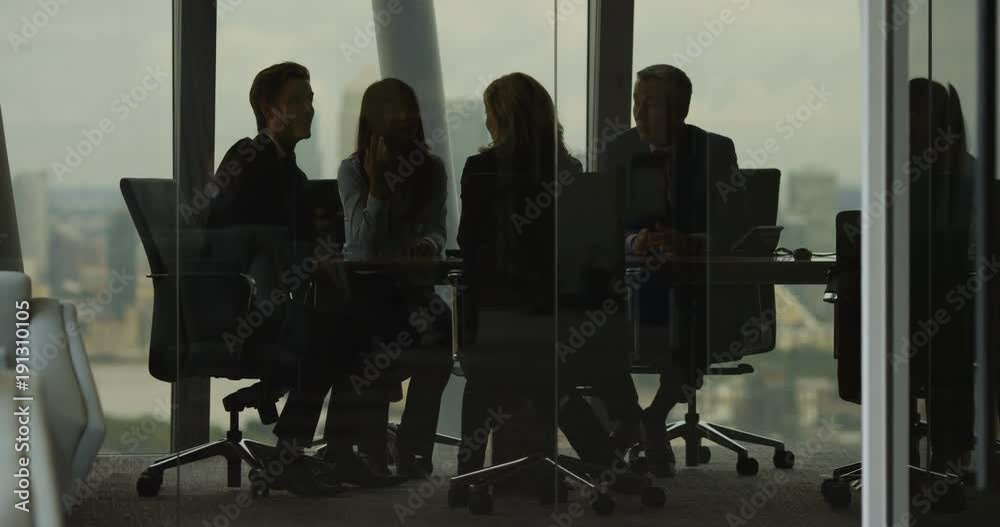 4K Business team having heated discussion boardroom meeting in city office. Slow motion.