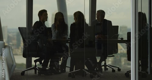 4K Business team having heated discussion boardroom meeting in city office. Slow motion.