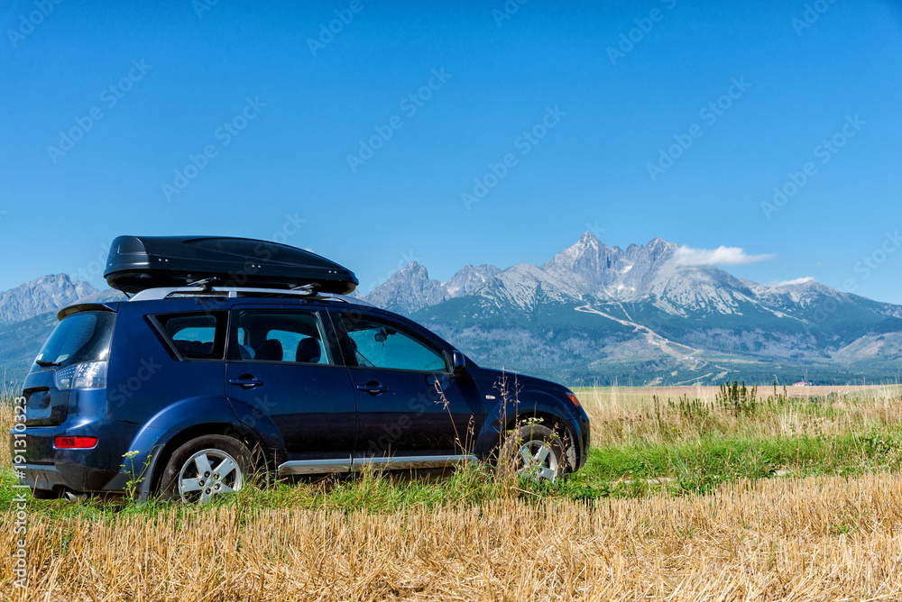 car for traveling with a roof rack on a mountain road car for traveling with a roof rack on a mountain road
