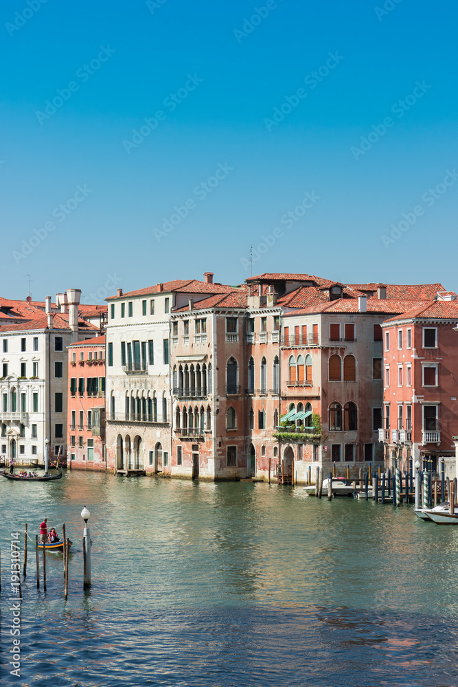 Walk through the charming, narrow streets of Venice, typical but magical view - canals, bridges and old tenements,  Canal Grande