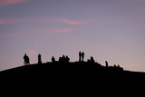 People's silhouette and sunset