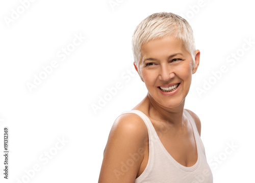 Portrait of a beautiful elderly woman, smiling, isolated on white background 