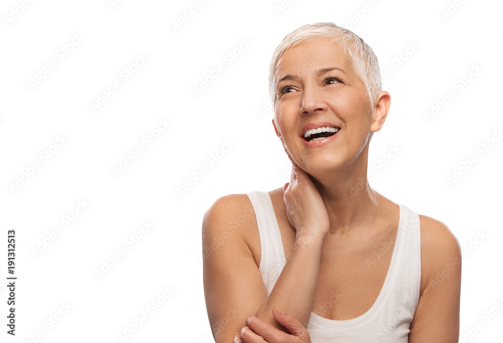 Portrait of a beautiful elderly woman, smiling, isolated on white background Portrait of a beautiful elderly woman, smiling, isolated on white background