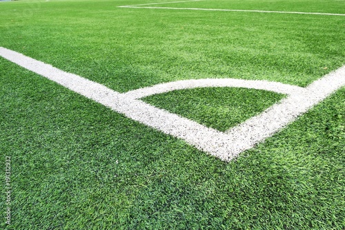 Corner Soccer field or football field texture background. White lines on green grass. Sport background concept.