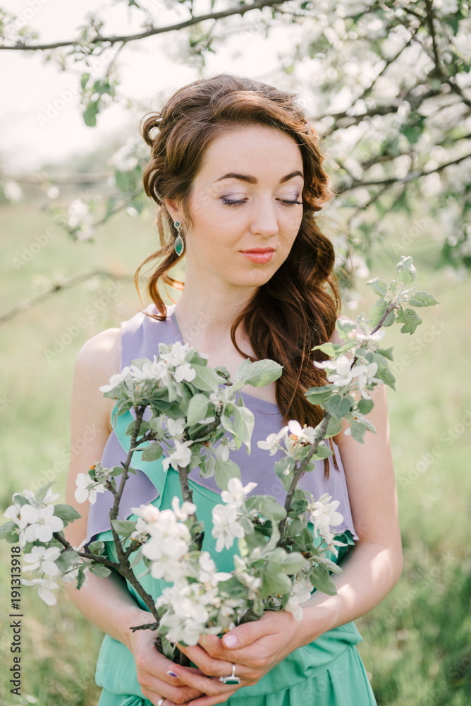 girl with closed eyes and apple tree in hands girl with closed eyes and apple tree in hands