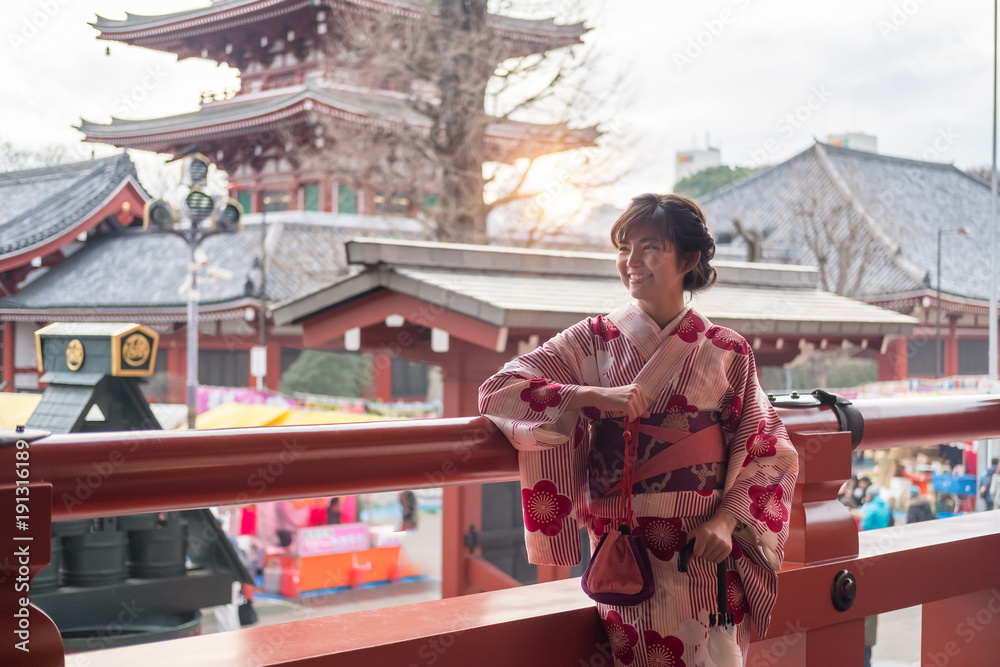 Attractive asian woman wearing kimono at Sensoji Asakusa Temple, Tokyo, Japan