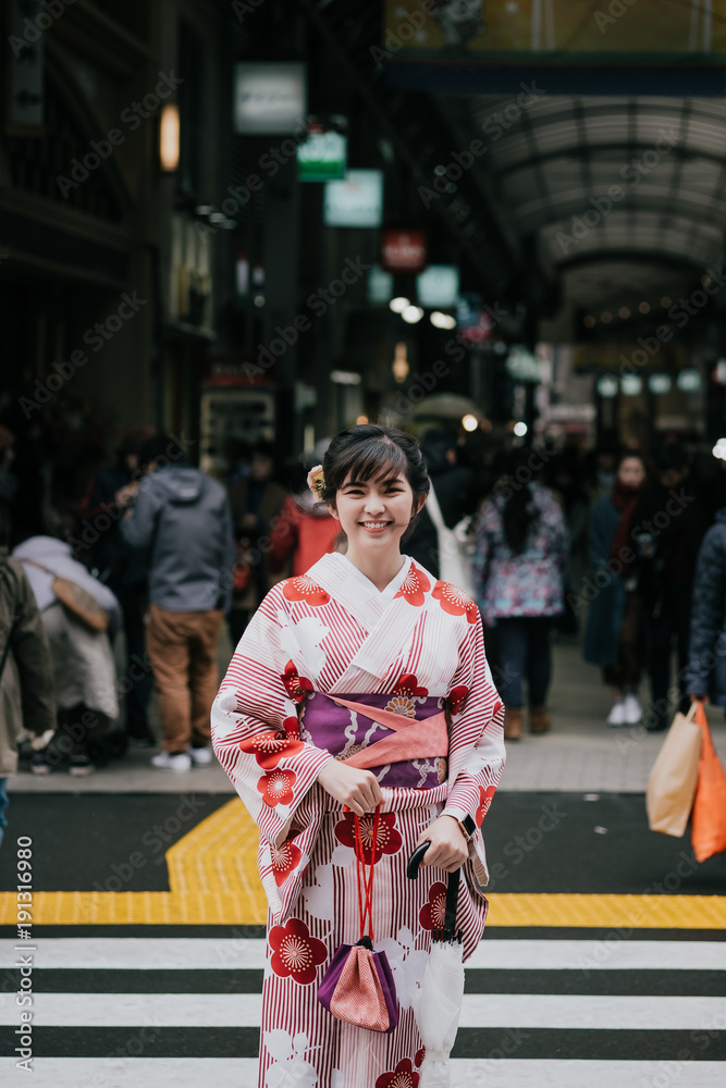 Beautiful asian girl wearing traditional japanese kimono in Asakusa Tokyo, Japan.