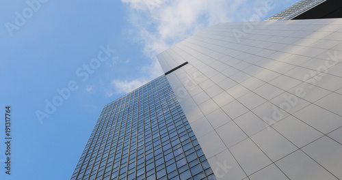 Business office tower with sunny skyline