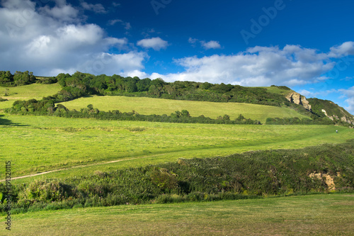 Devon s landscape. Green hill and blue sky. Good peaceful weather. Devonshire. UK