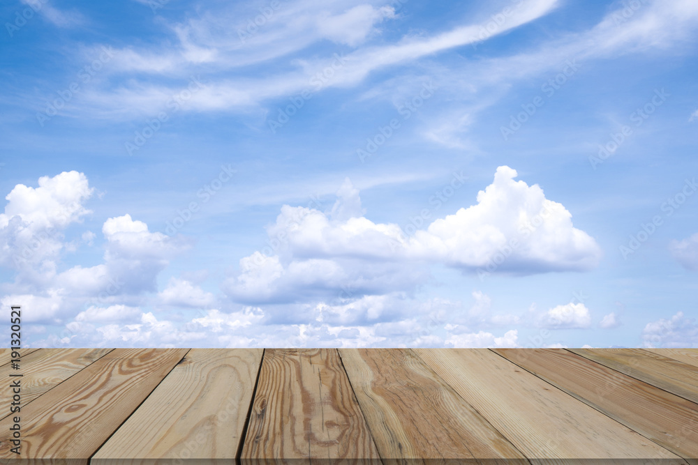 Blue sky with beautiful clouds and wooden space.