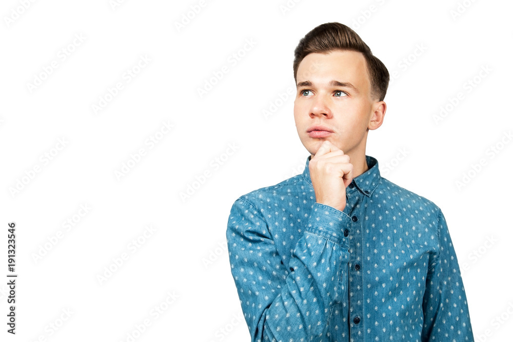 Portrait of the young thinking guy looks up with hand near face - isolated on white background. Portrait of the young thinking guy looks up with hand near face - isolated on white background.