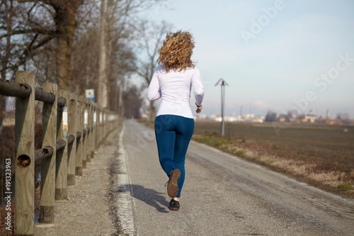 woman running in fall winter  photo