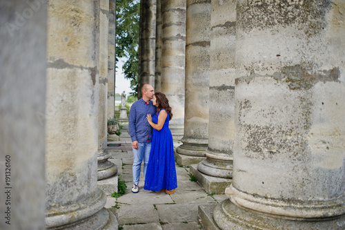Lovely couple in love against old castle. Girl in blue dress. © AS Photo Family