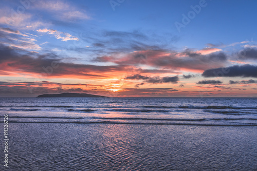 Orange sunrise over ocean in Rush Ireland © Jonas