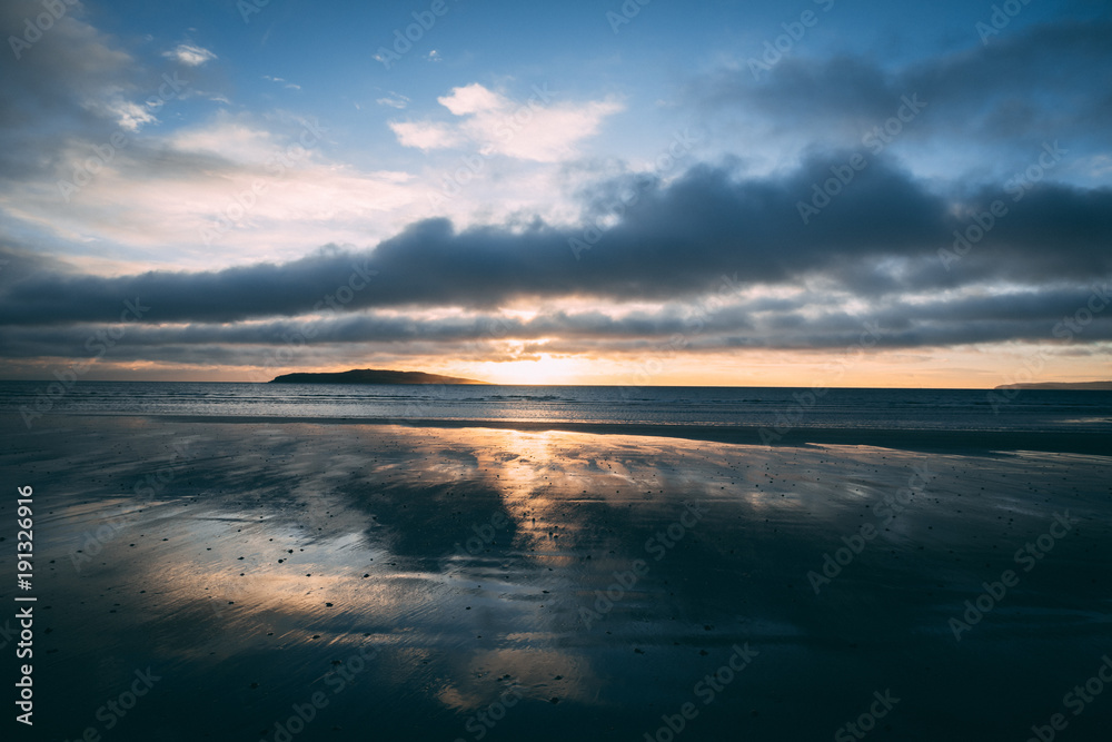 Fototapeta premium Bright sunrise on beach in Rush Ireland