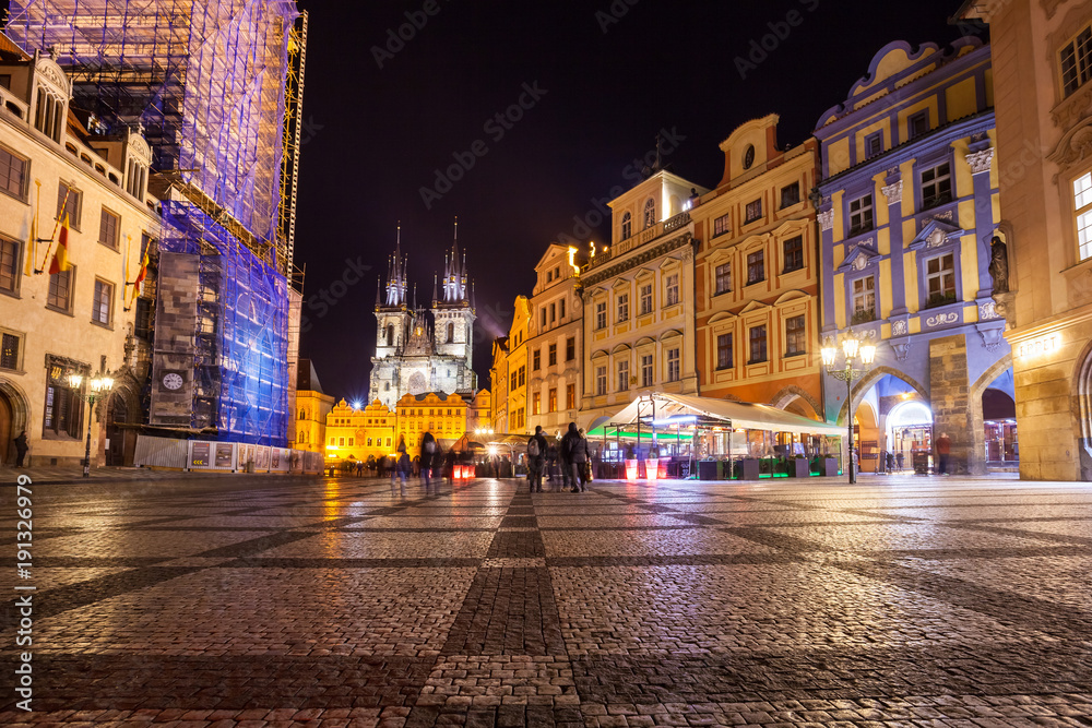 Night time illuminations of the magical Old Town Square in Prague, visible are Kinsky Palace and gothic towers of the Church