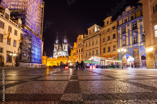 Night time illuminations of the magical Old Town Square in Prague, visible are Kinsky Palace and gothic towers of the Church © k_samurkas